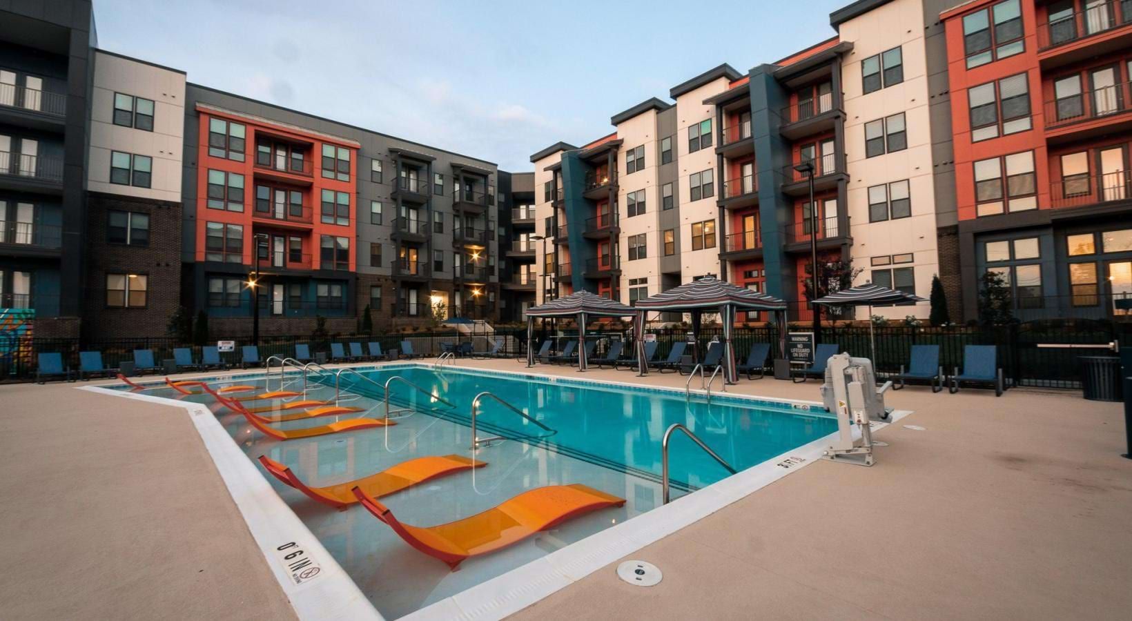 Evening courtyard and pool at a 299-unit Class A multifamily property